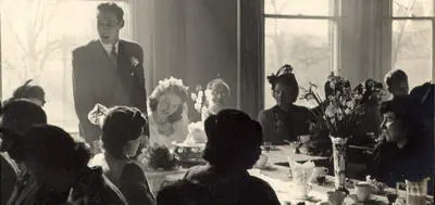 An old (1950s) black and white photograph of a wedding.