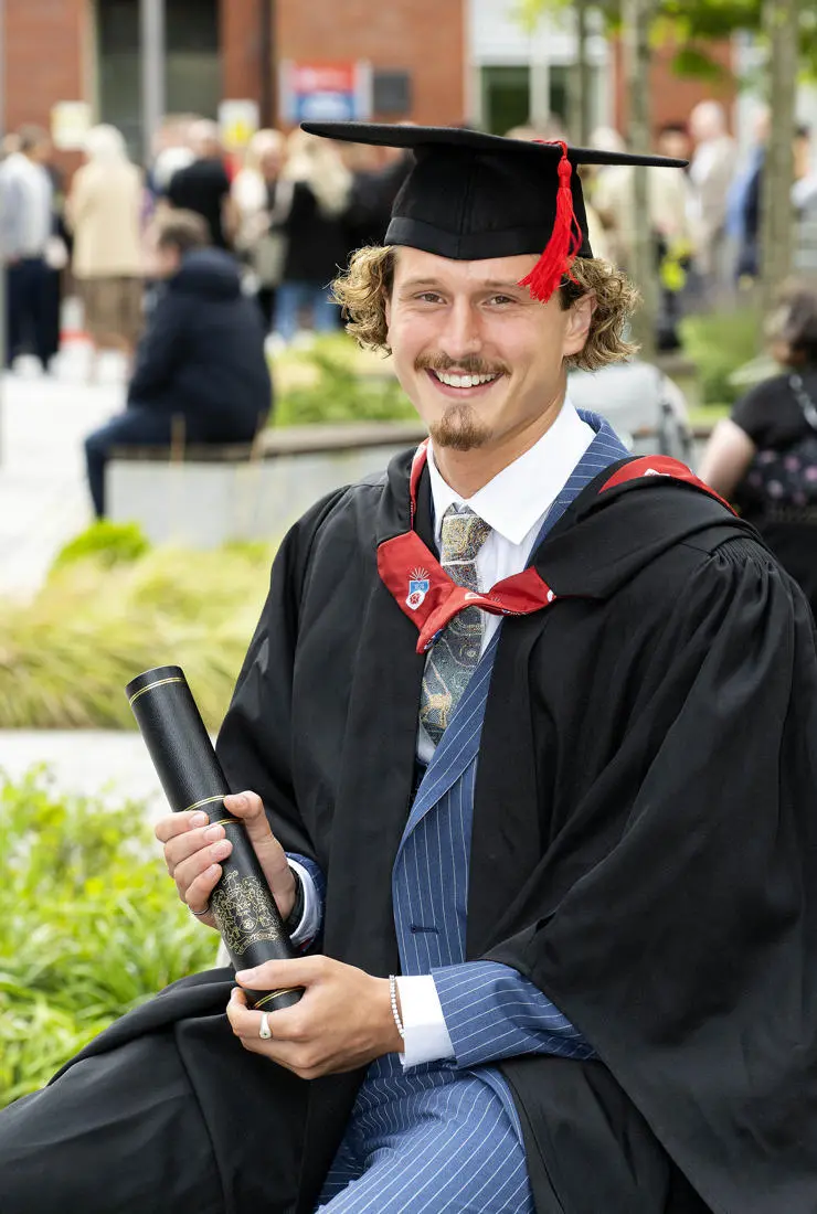Adam at his UCLan graduation ceremony
