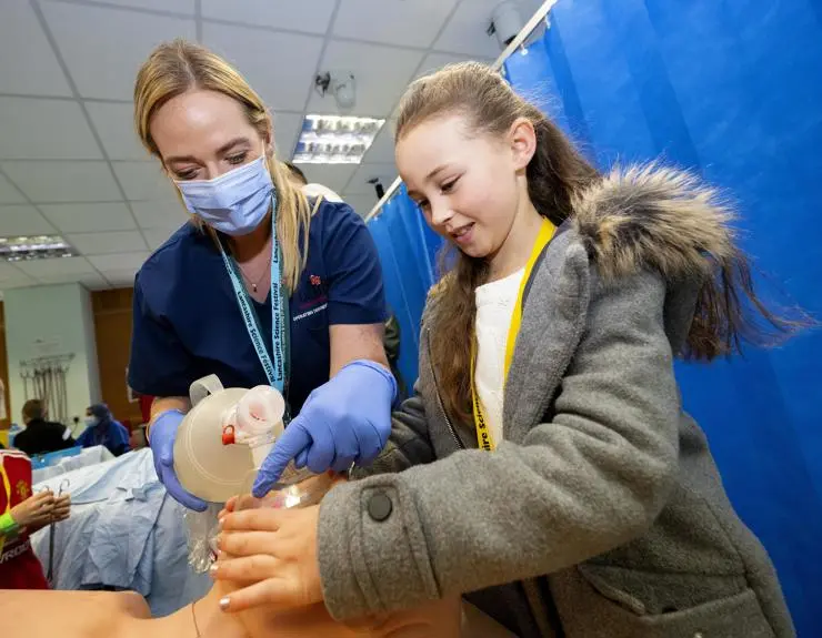 UCLan's Charlotte Harrison helping Leah Gornall in the operating department room