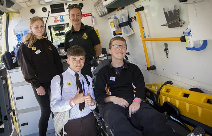 Pupils from from Baines School tour an ambulance (Top) Lucy Busby, 12, with paramedic Rebekah Morris (bottom) Jack Wackinson, 15, and Eryk Kosmider, 13. 