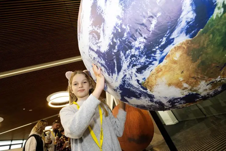 Isla Haworth holding Earth