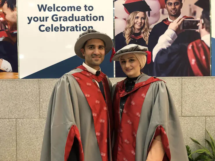 The couple celebrate at their UCLan graduation ceremony