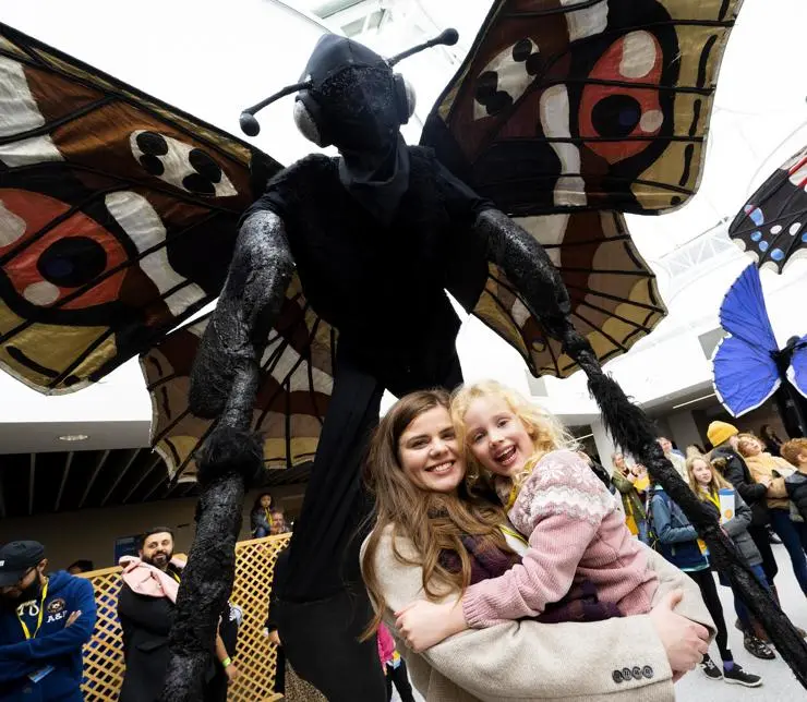 Five-year-old Violet Kellett and her mum Natalie Grist with a giant butterfly