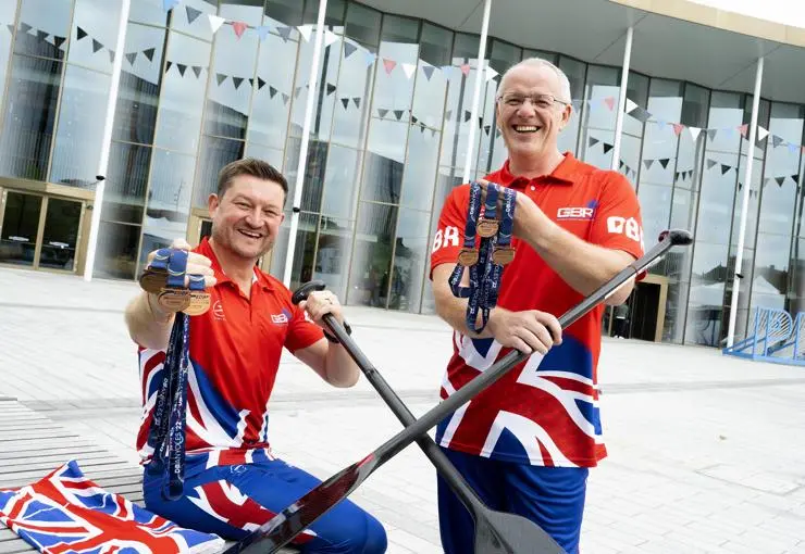 Tony Dickson and Ian Carrie in their Team GB kit with their trio of bronze medals