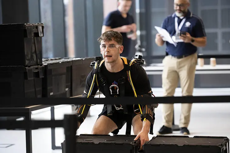 UCLan MSc Mechatronics student Mackenzie Lafferty takes part in the pallet lifting exercise.
