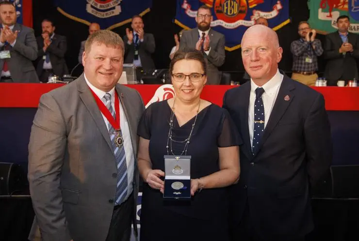Professor Anna Stec is presented with her FBU Solidarity Medal by FBU President Ian Murray (left) and FBU General Secretary Matt Wrack (right). Photo credit: Mark Thomas