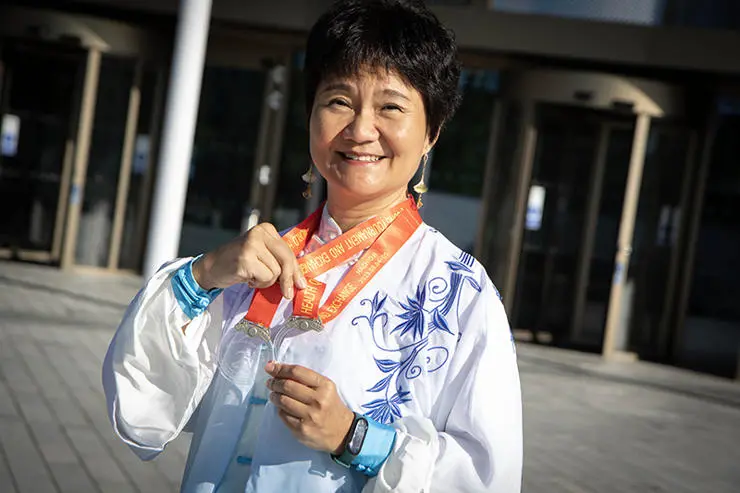 UCLan Confucius Institute Director Feixia with her two silver medals from the 10th World Health Qigong Tournament and Exchange in Tokyo