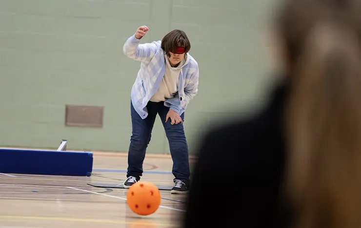 Student Erin Boyce has her first go at goalball