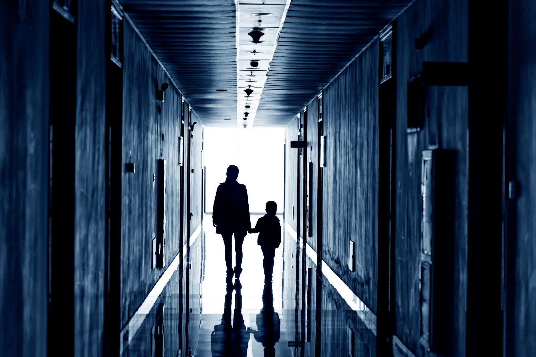 Lonely parent with child in corridor