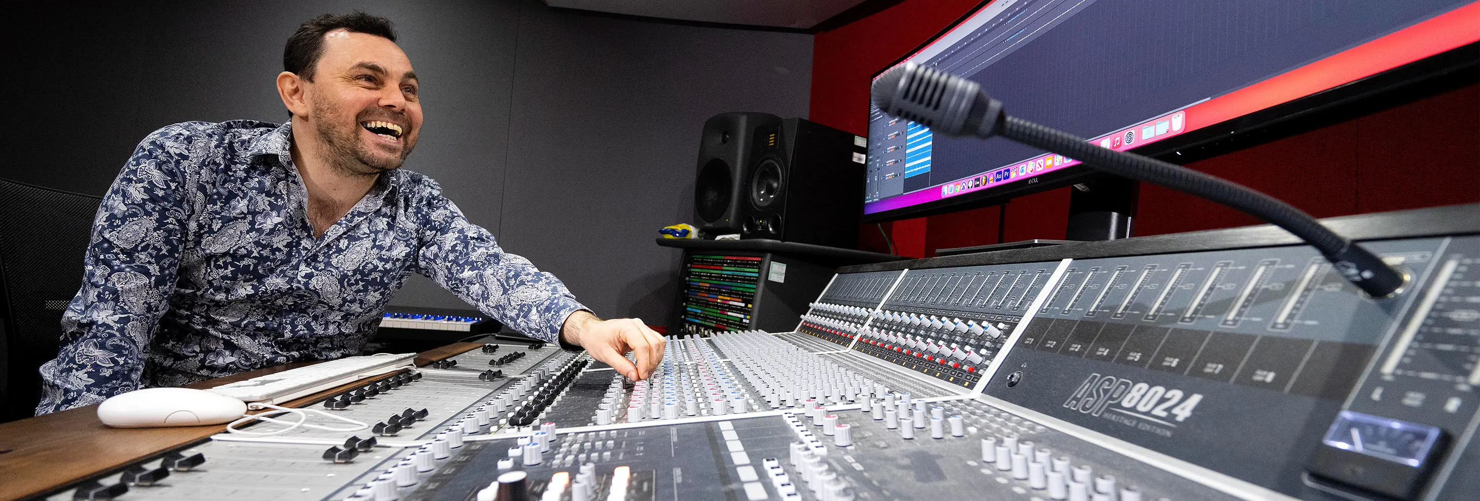 UCLan MA Music Industry Management and Promotion student Paul Wolski at a mixing desk in UCLan’s Media Factory.