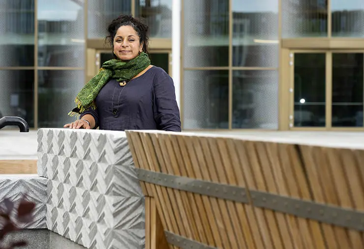 Halima next to a planter seat on the new UCLan University Square. 