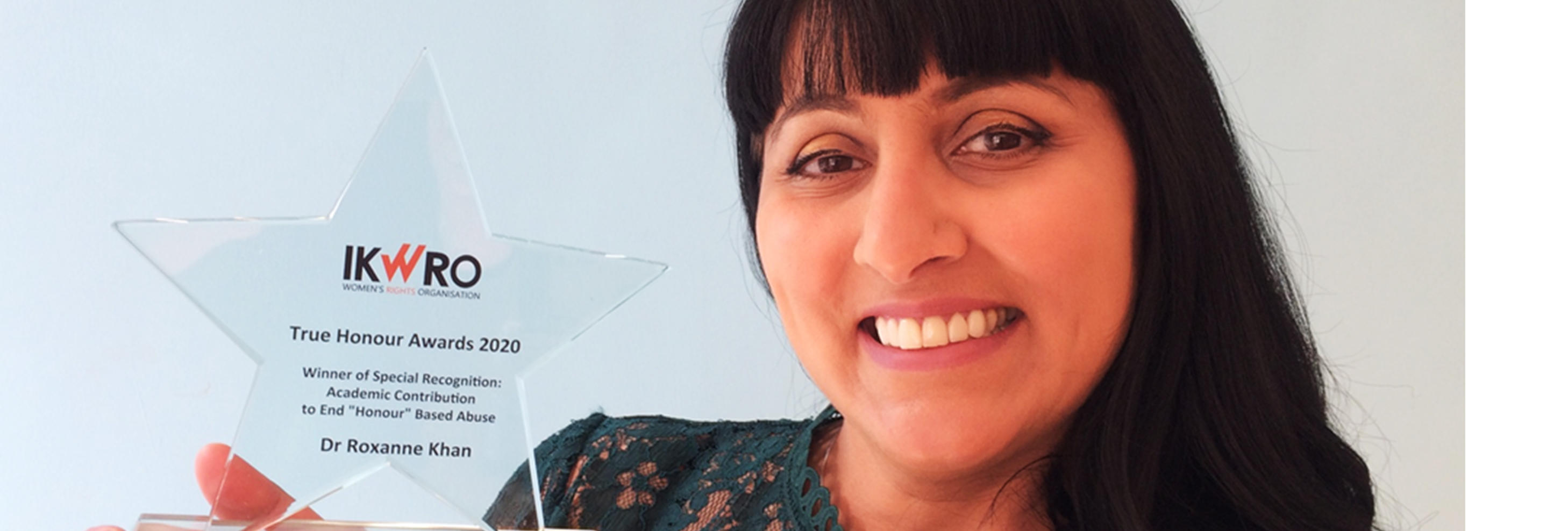 Roxanne Khan pictured with her award