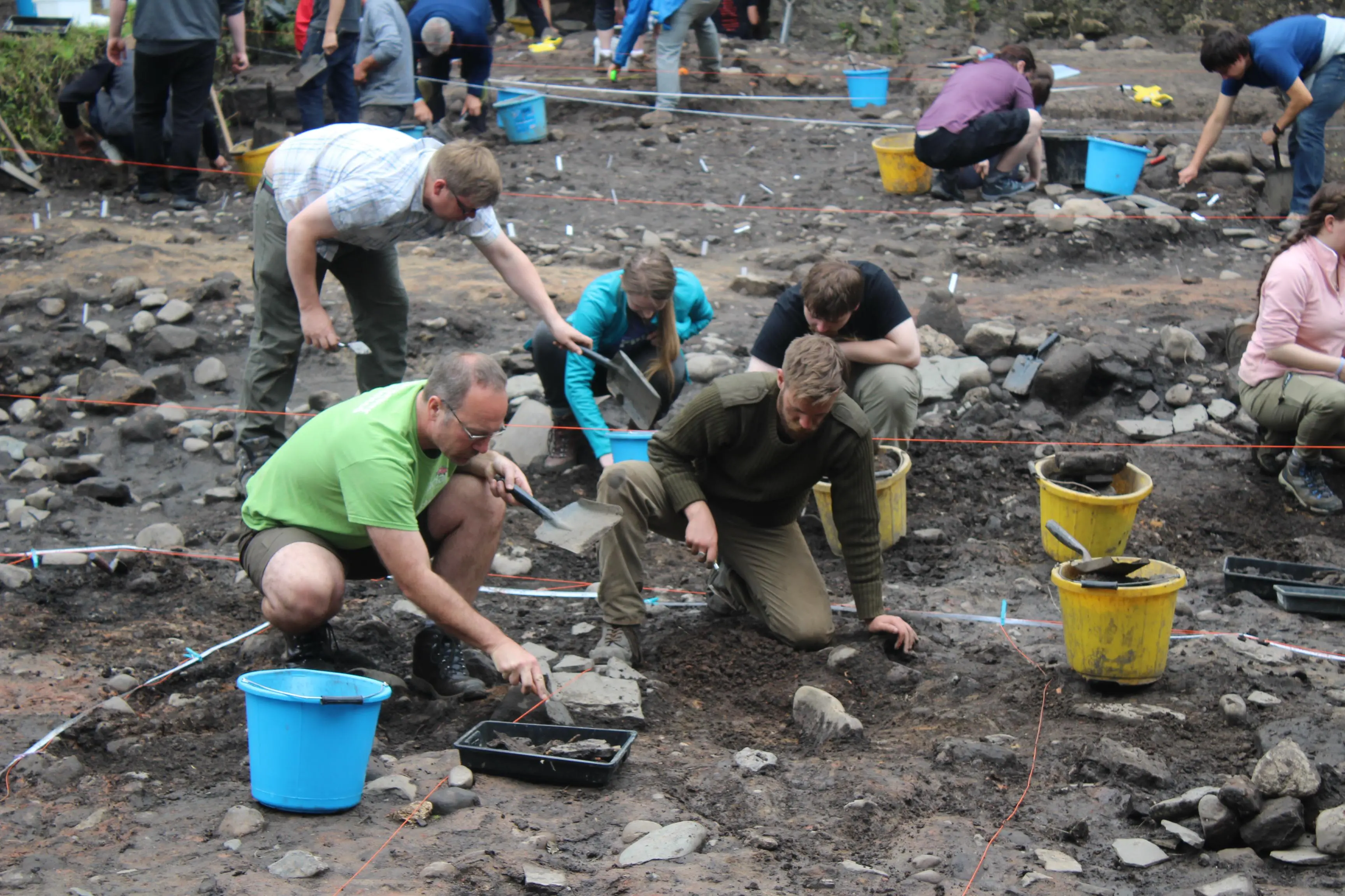 People digging on an archaeological dig site