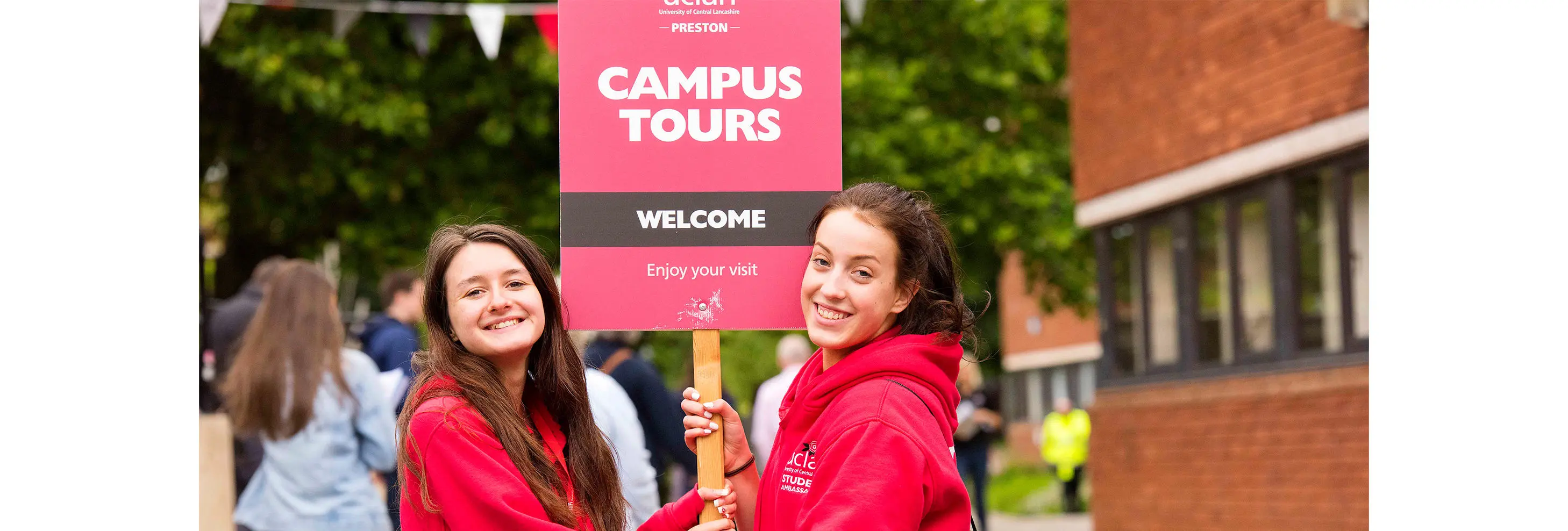 Two UCLan students leading a campus tour