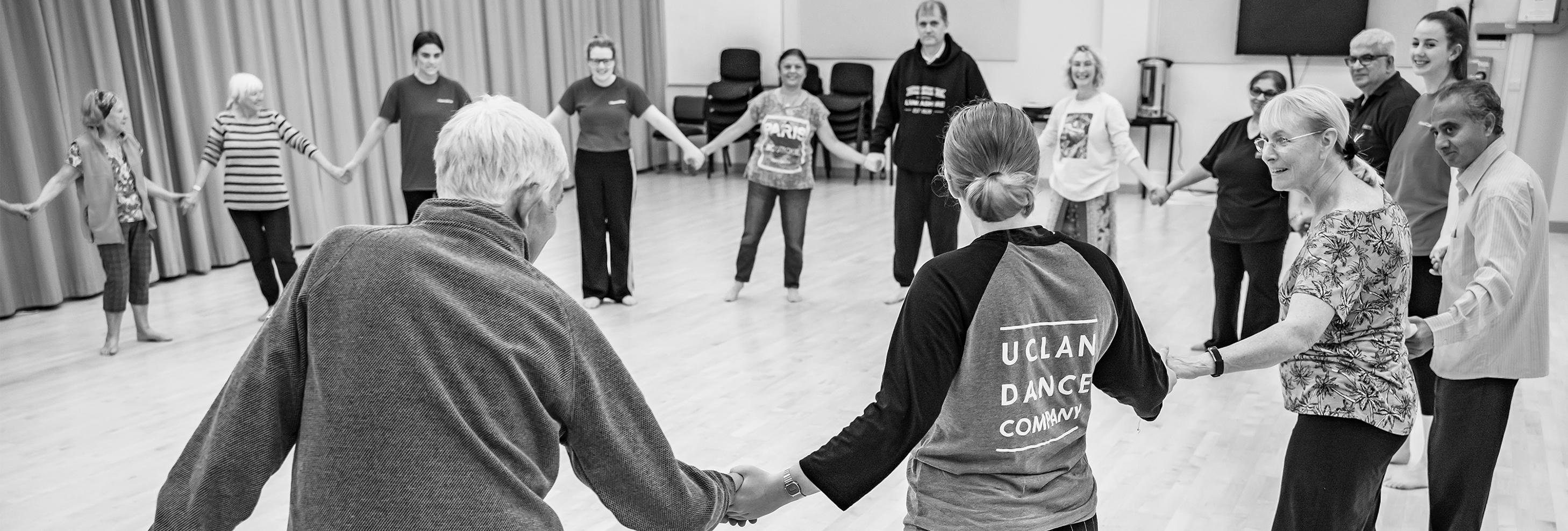 UCLan dance students work with people living with Parkinson's in a dance class