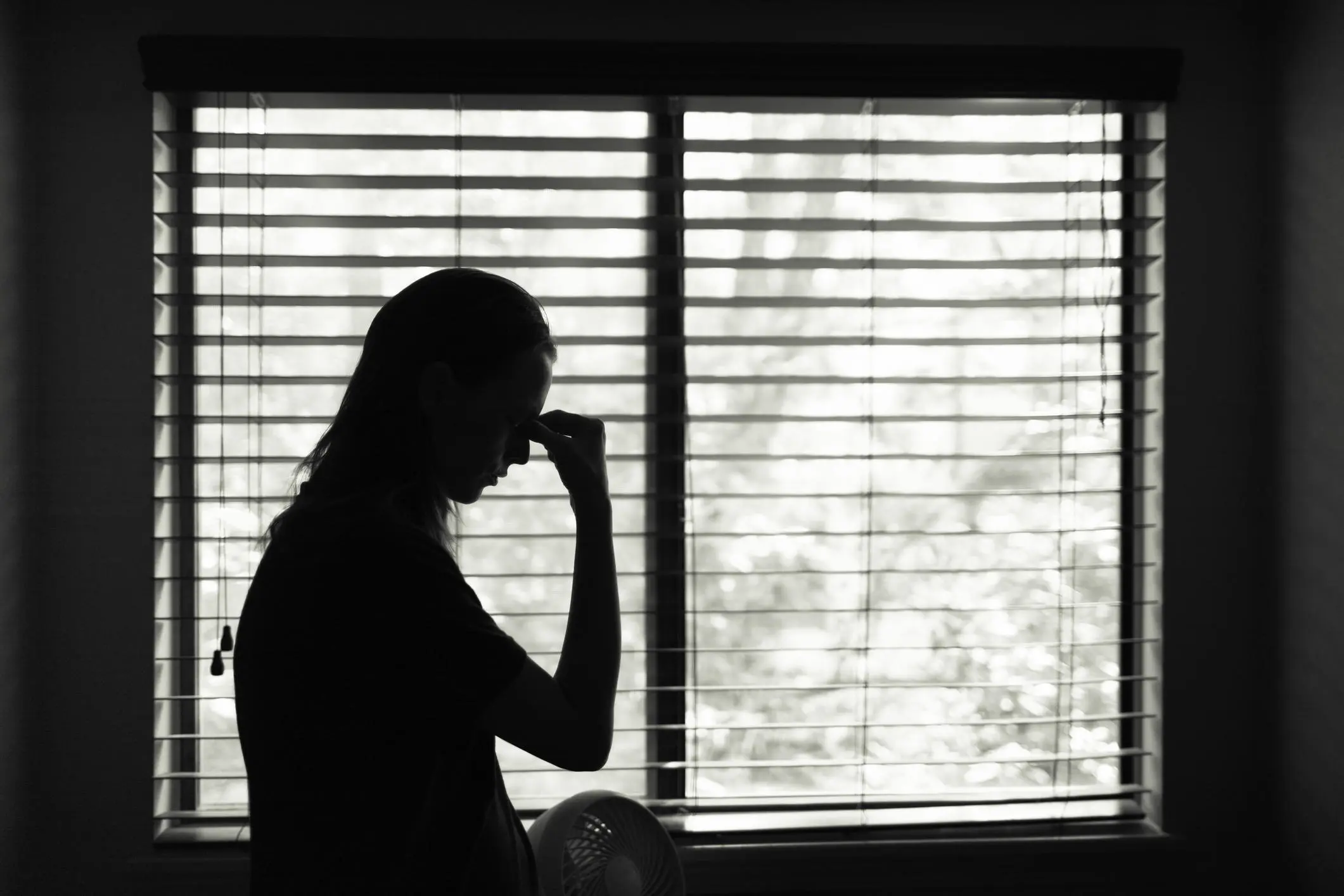 Silhouette of distressed woman