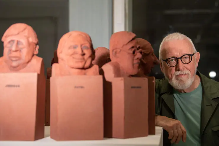 Geoffrey Elliott with his handmade busts