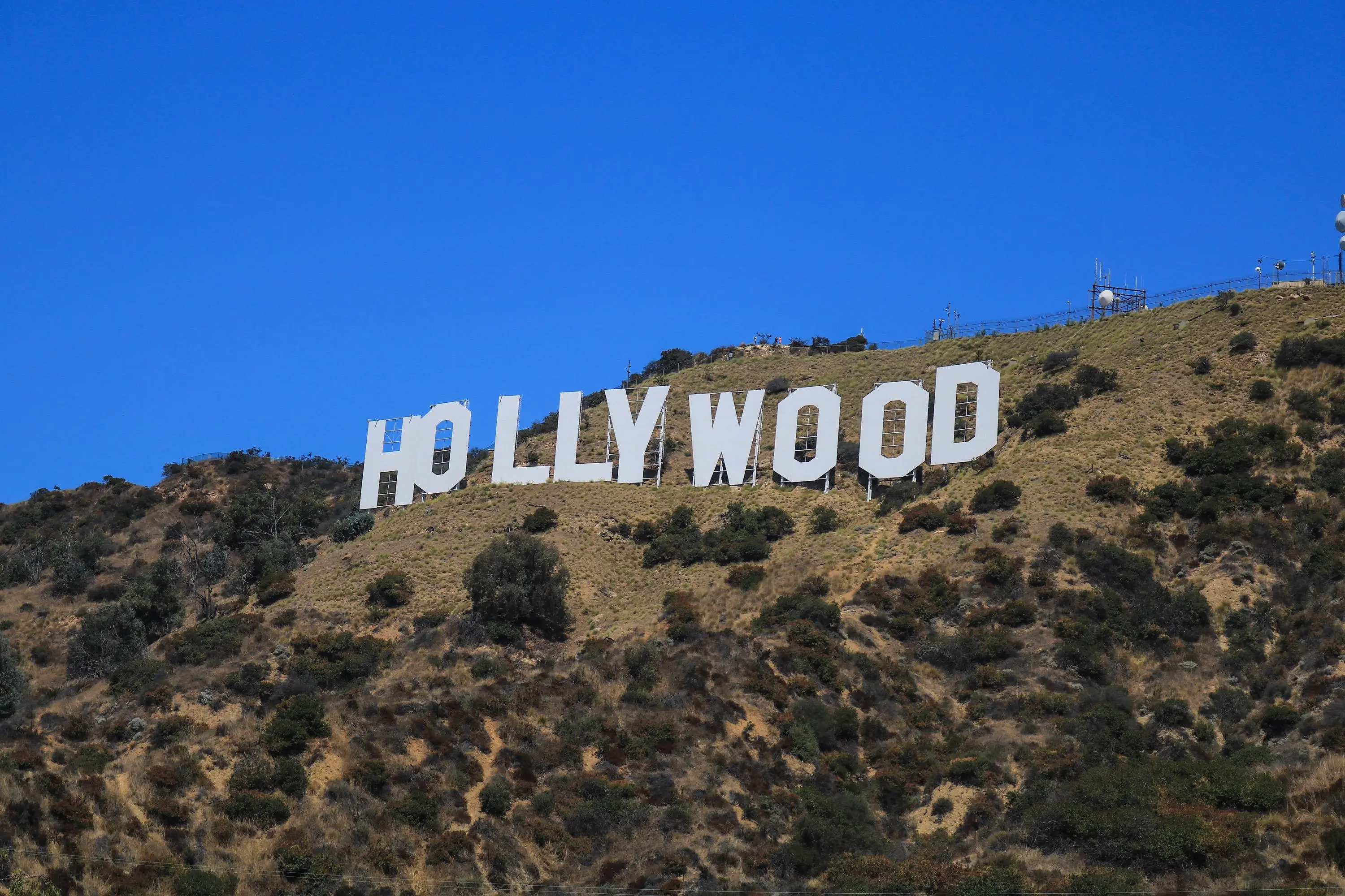 white letters spelling out hollywood on a los angeles mountain top