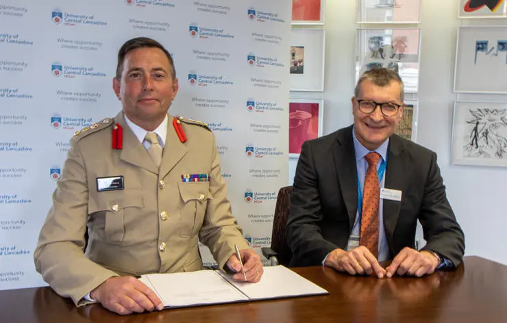 L-R: Colonel Darren Doherty, Commander North West Region, and UCLan’s Vice-Chancellor Professor Graham Baldwin re-sign the Armed Forces Covenant   