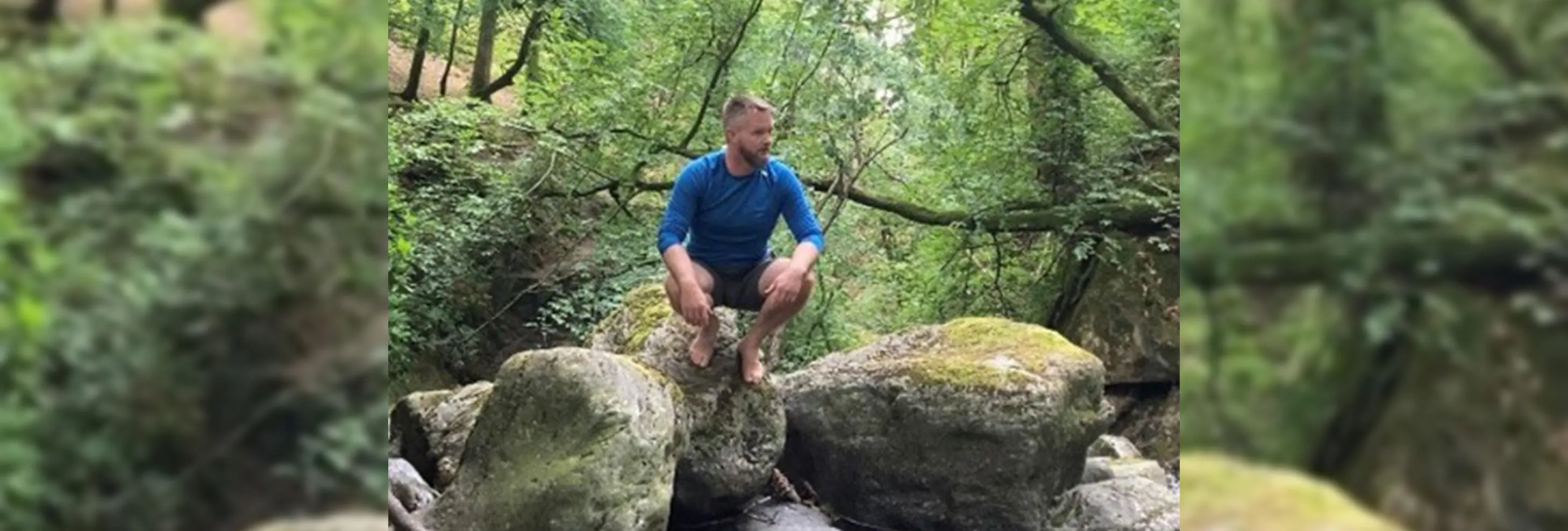 Richard Whall sat on a large rock