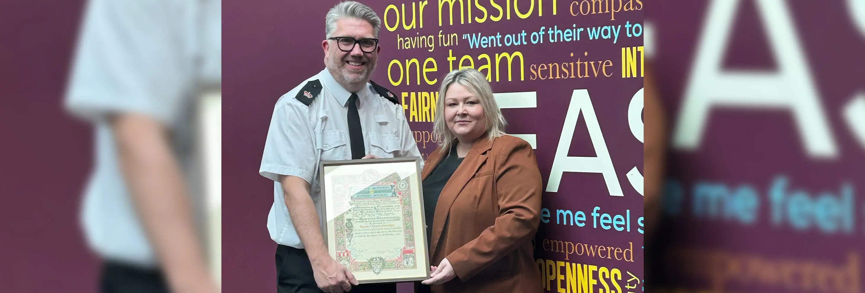 UCLan midwifery student is presented with her Liverpool Shipwreck and Humane Society Award parchment for bravery from Lancashire Police’s East Division Headquarters Operations Manager Superintendent Derry Crorken.