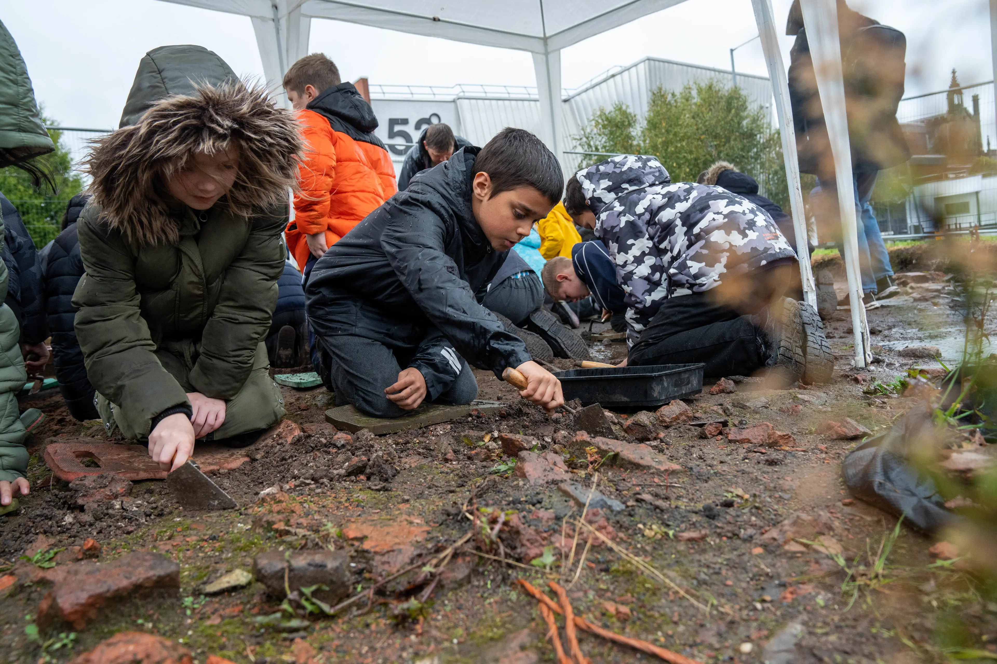 Two pupils on an archaeological dig
