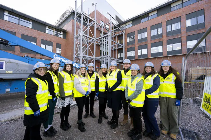 Vet staff and students seeing the first part of the steel structure taking shape