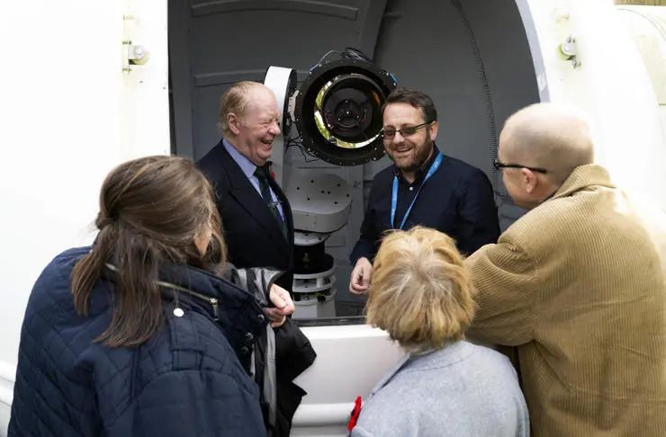 UCLan astronomy lecturer Mark Norris shows Patrick Holden and his family around the new telescope.