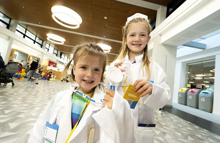 Sisters Erin, 3, (left) and Lucy Loftus from Formby dress up as scientists 
