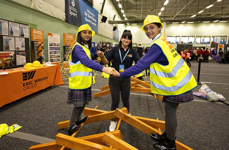 Khadigah Mohson, 10, (left) and Umaimah Ahmad, 10 from The Olive School with Nataie Ashworth from Eric Wright Construction