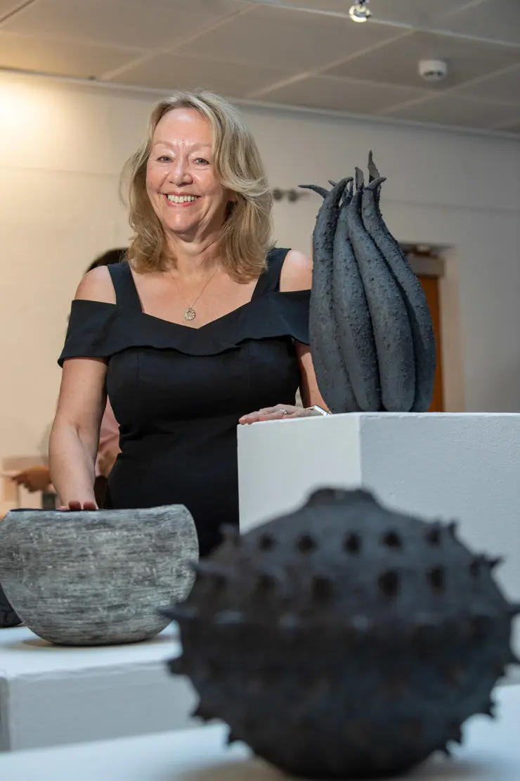 Andrea Welsh with her clay pods