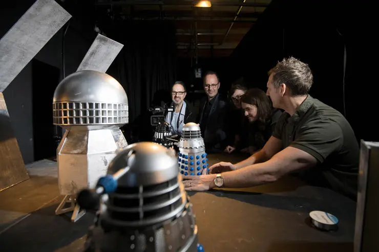 Members of the TV crew with the miniature Daleks