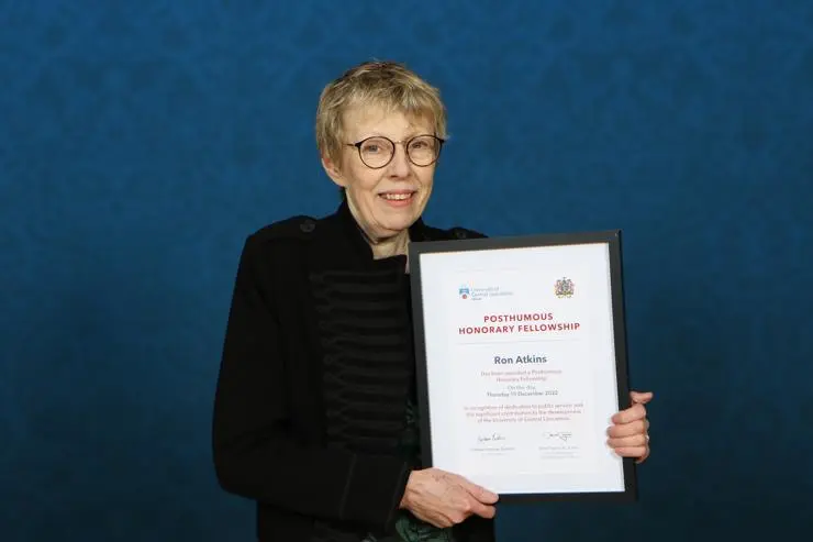 Liz Atkins with her late husband Ron Atkins' posthumous Honorary Fellowship certificate