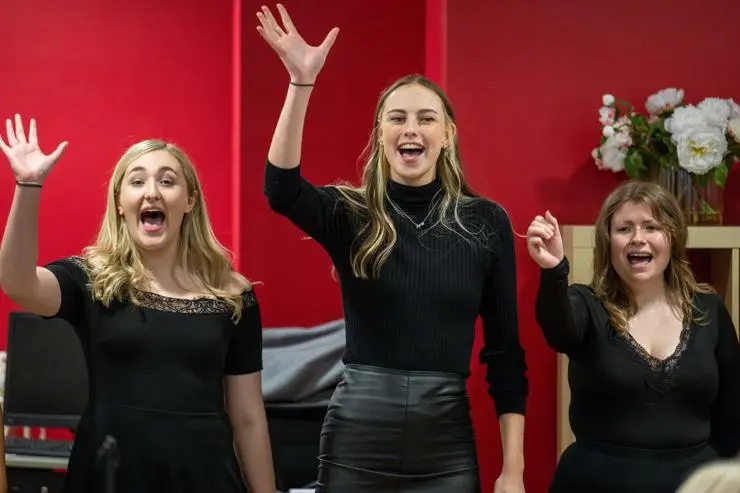 Three women singing
