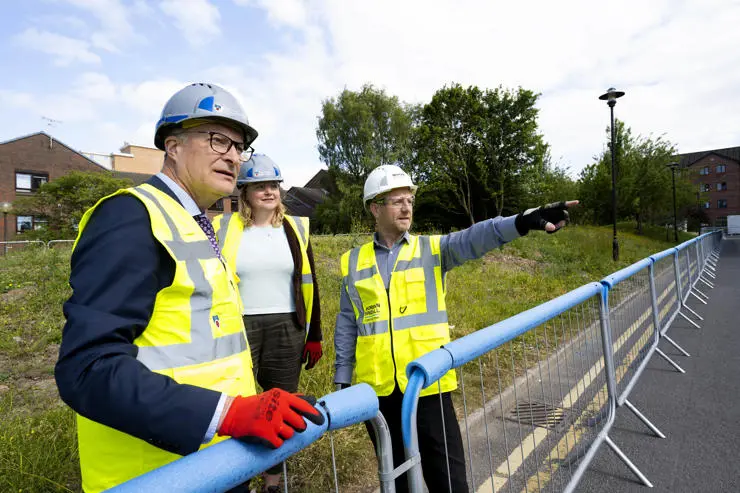 Morgan Sindall's Paul Galloway showing UCLan Vice-Chancellor Professor Graham Baldwin and Dr Heather Bacon OBE, Head of UCLan's School of Veterinary Medicine, the building site.