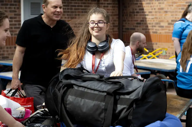 Students moving possessions into their accommodation