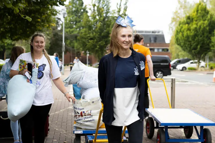 Volunteers from UCLan sports teams helped new students carry their creature comforts into their student accommodation