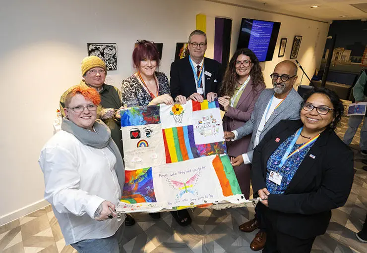 The Rainbow Roses exhibition. (L-R) Artists Pixie and Leigh Willow, artist and UCLan student Emma Preston, UCLan Pro Vice-Chancellor and Vice Chancellor’s Group LGBTQ+ ally Professor StJohn Crean, Beth Meadows, Support Worker from Lancashire LGBTQ+, Director of EDI at UCLan Pradeep Passi and UCLan EDI Staff Development and Inclusive Culture Officer Suely Ludgero-Newlove.