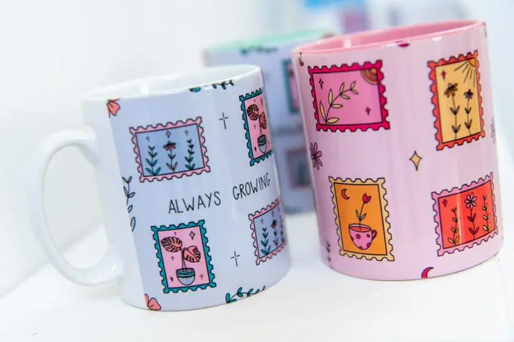 Three decorated mugs